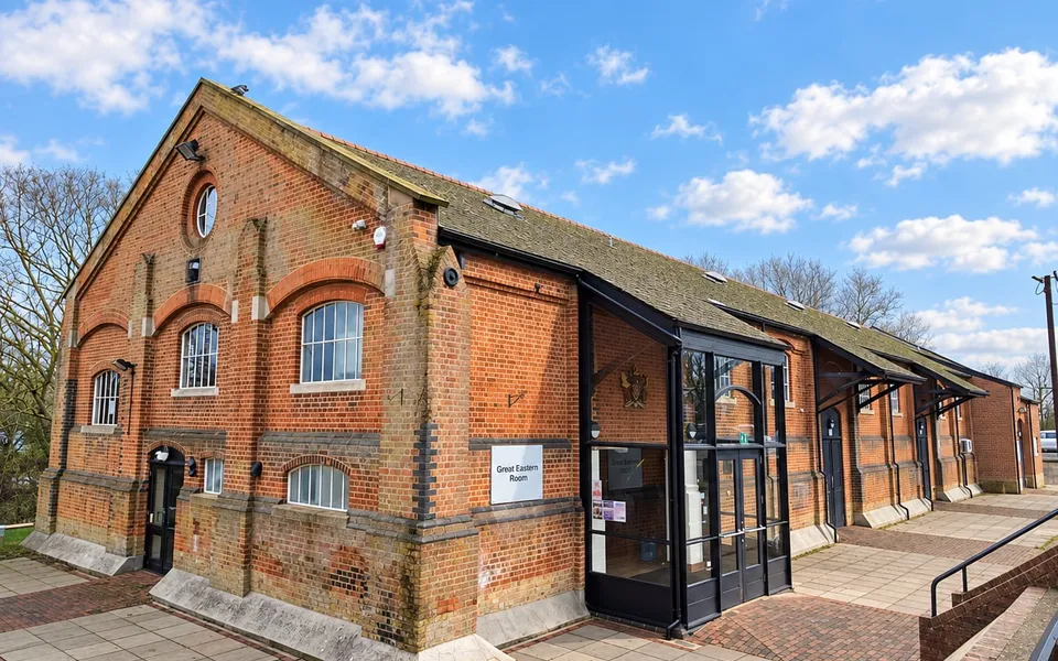 The outside of the Freight House from the car park, showing the glazed entrance. TODO: replace with a photograph of the hall itself.